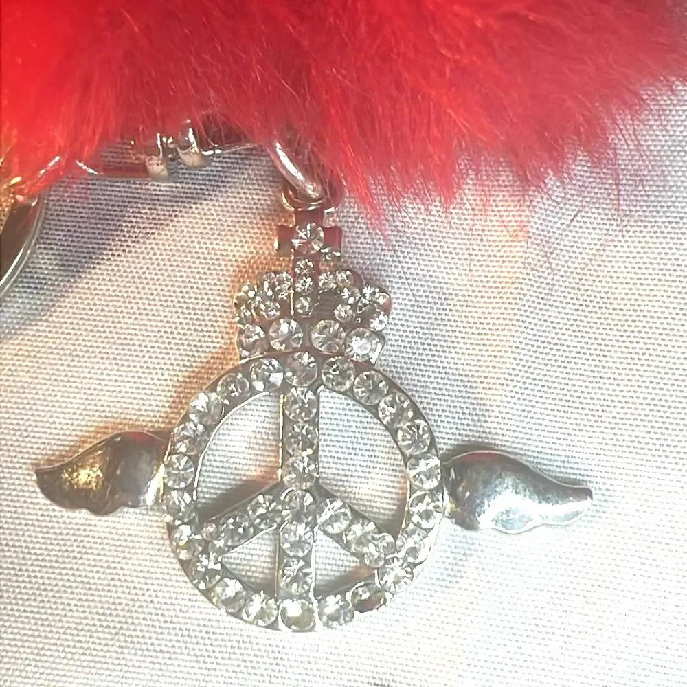 Purse Charm with Peace Sign with wings and Red Pom Pom. Purse Charm w/Key Ring